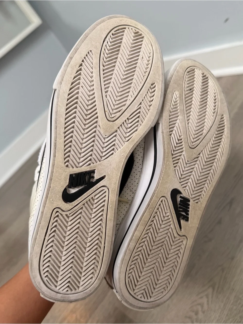 Nike Women's White High-Top Sneakers with Black Swoosh